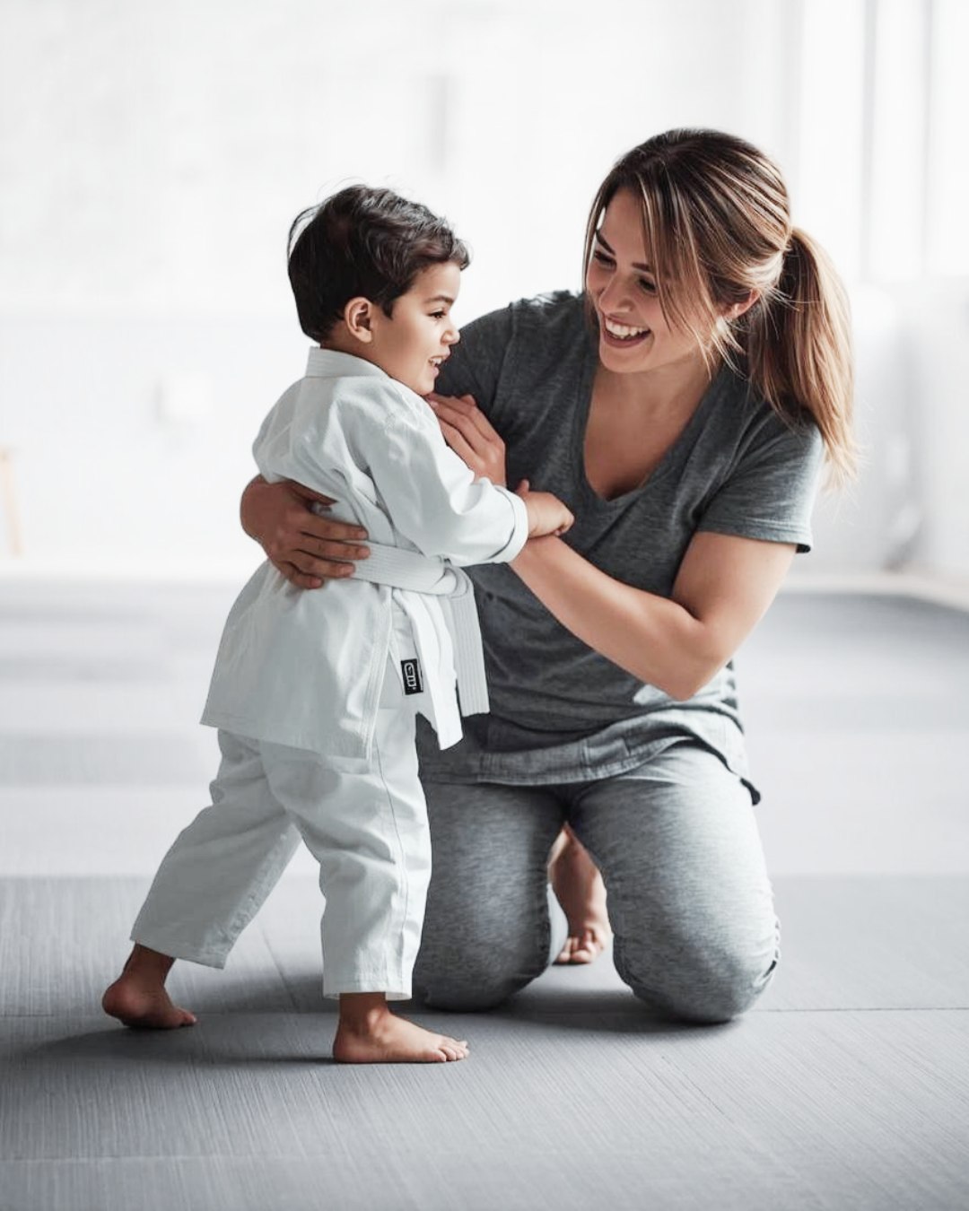 A Mini Monkeys BJJ Student with their Mom